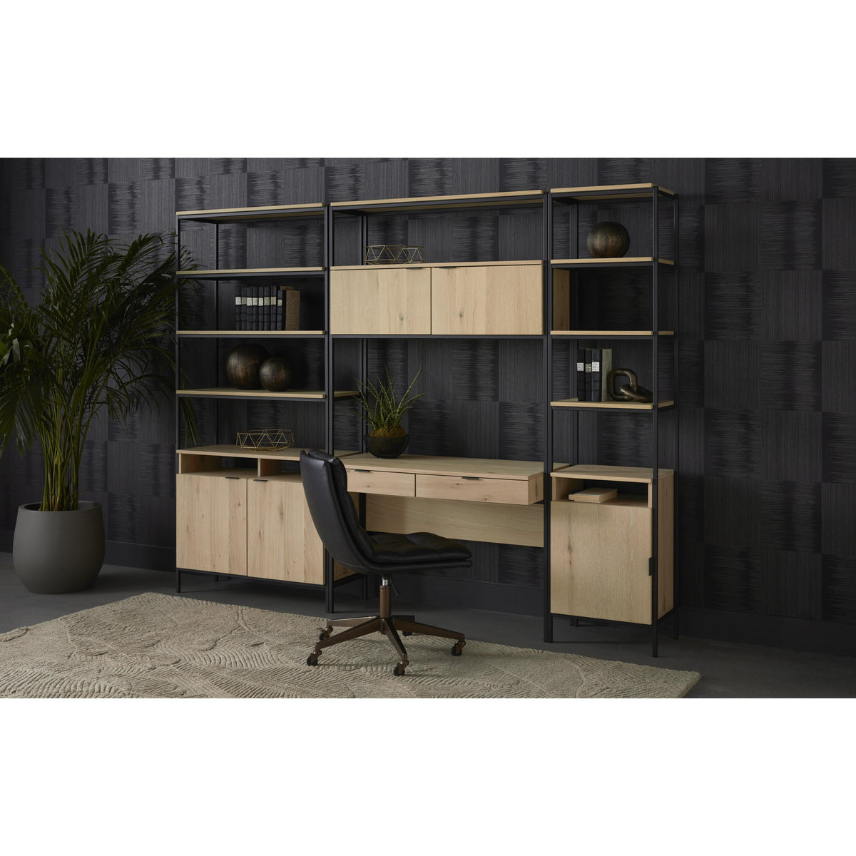 Modern office setup with wooden desk, shelves, and chair against a dark wall.