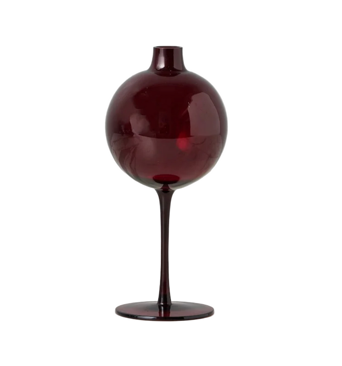 Dark red glass vase on a white background