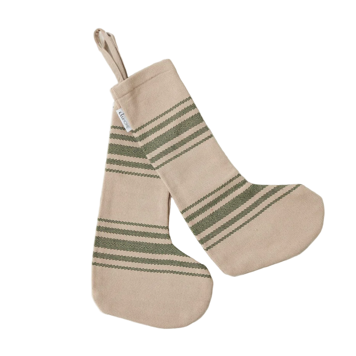 Beige and green striped Christmas stocking on a marble surface