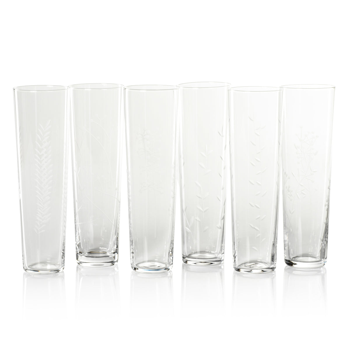 Set of six clear glass tumblers on a white background
